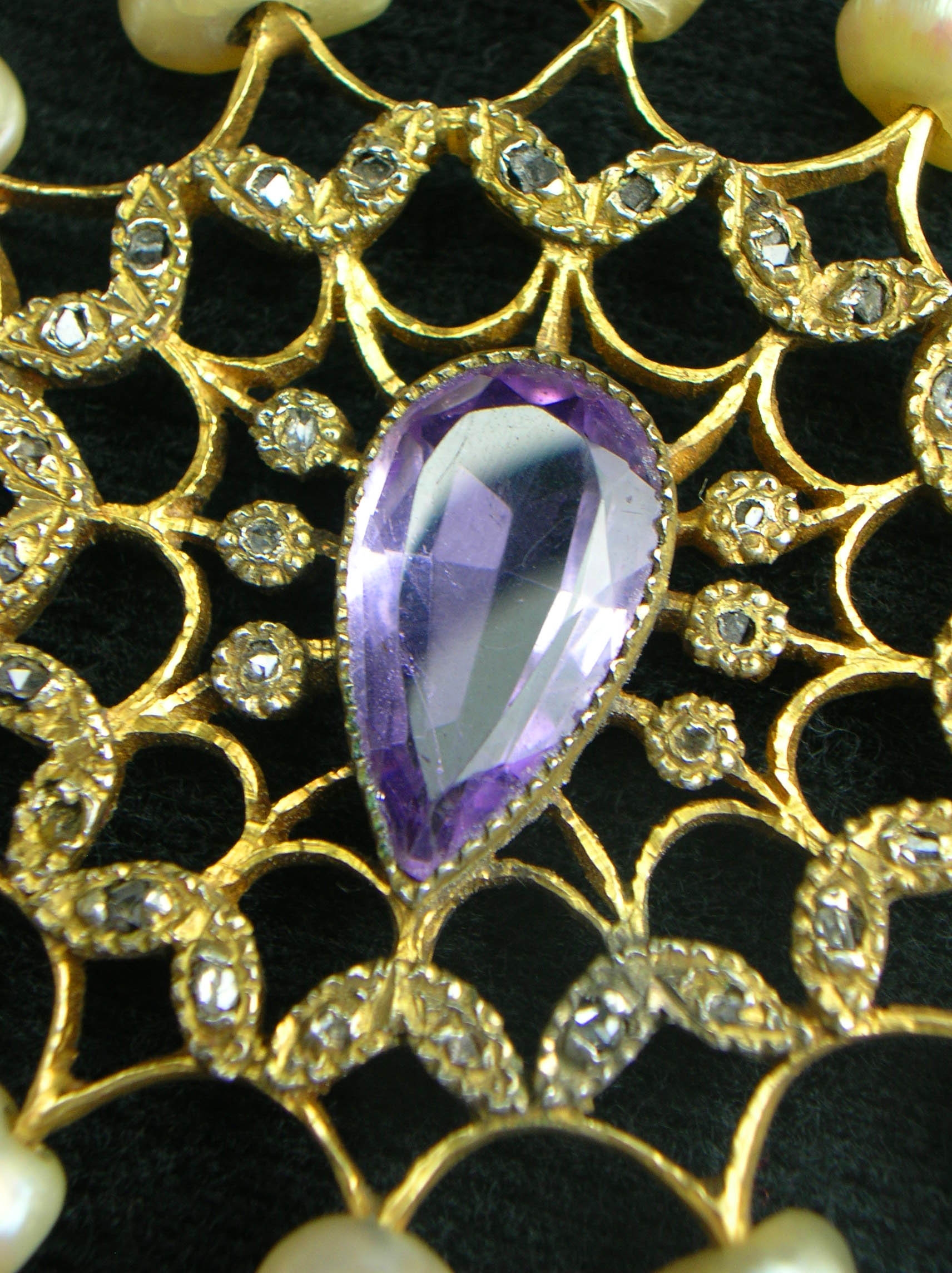 ROSARY: Showing hand faceted amethyst center / diamonds