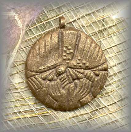 chaplet medal with Holy Spirit, hands lifted up