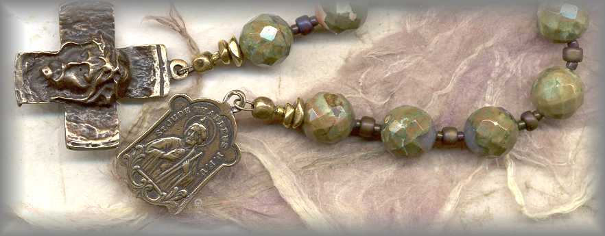 CHAPLET: closeup of faceted rhyolite beads and cross
