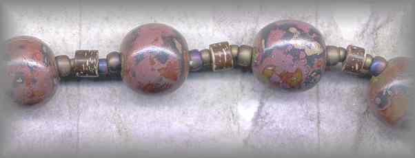 CHAPLETS: closeup of hand made lacquer beads