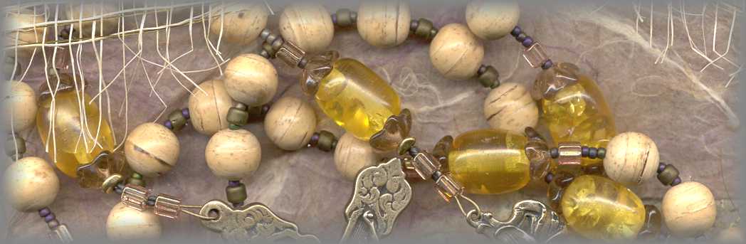 ROSARY - closeup of wooden beads and amber Paters