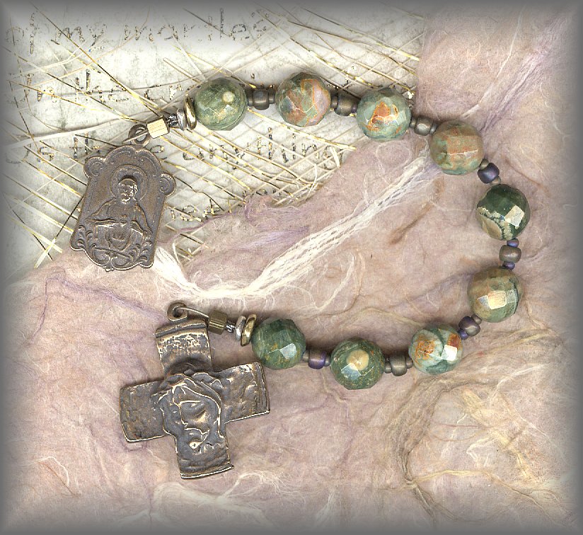 CHAPLET: closeup of faceted rhyolite beads and cross